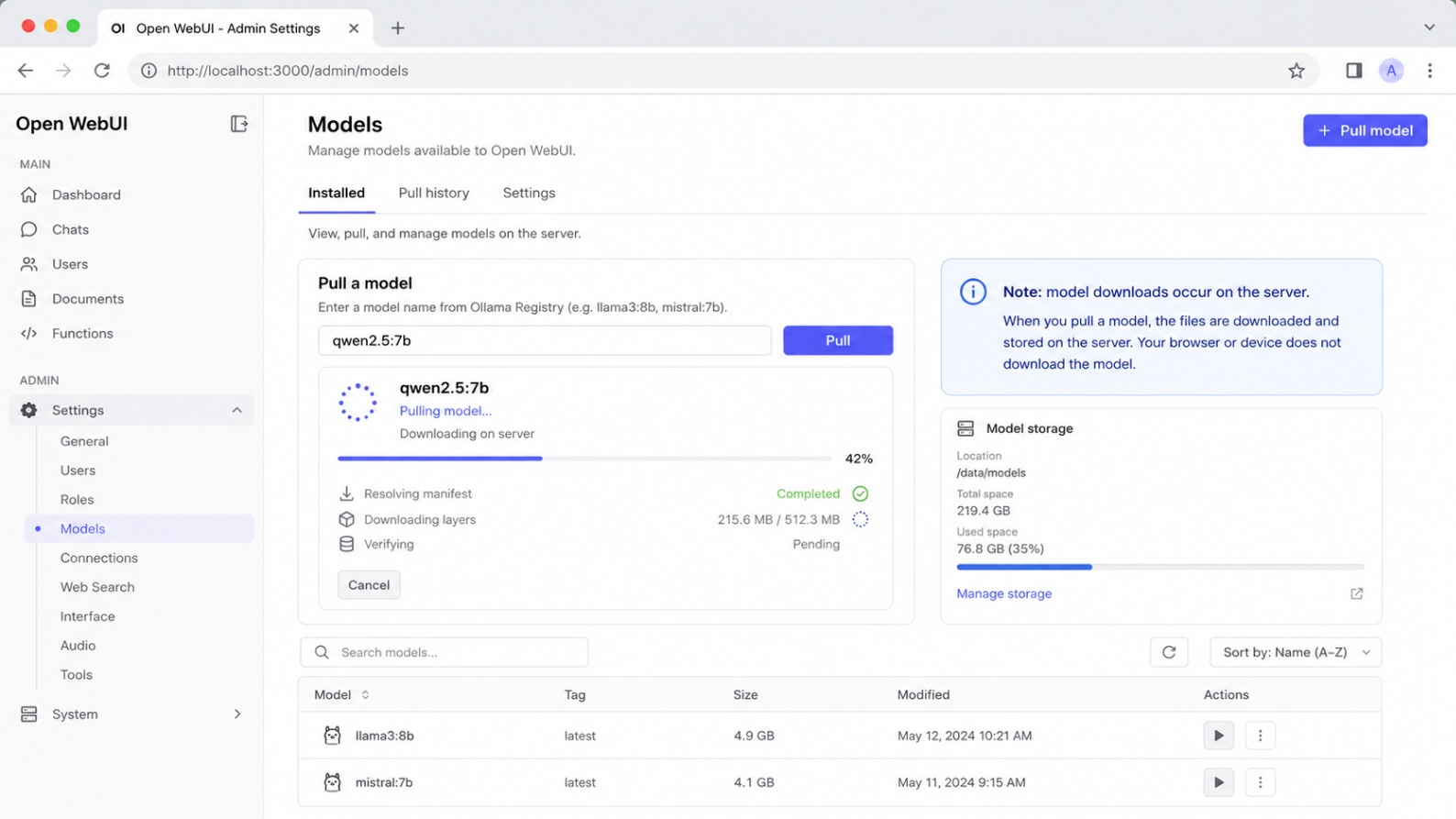 Open WebUI settings page showing model management and a model being pulled from Ollama
